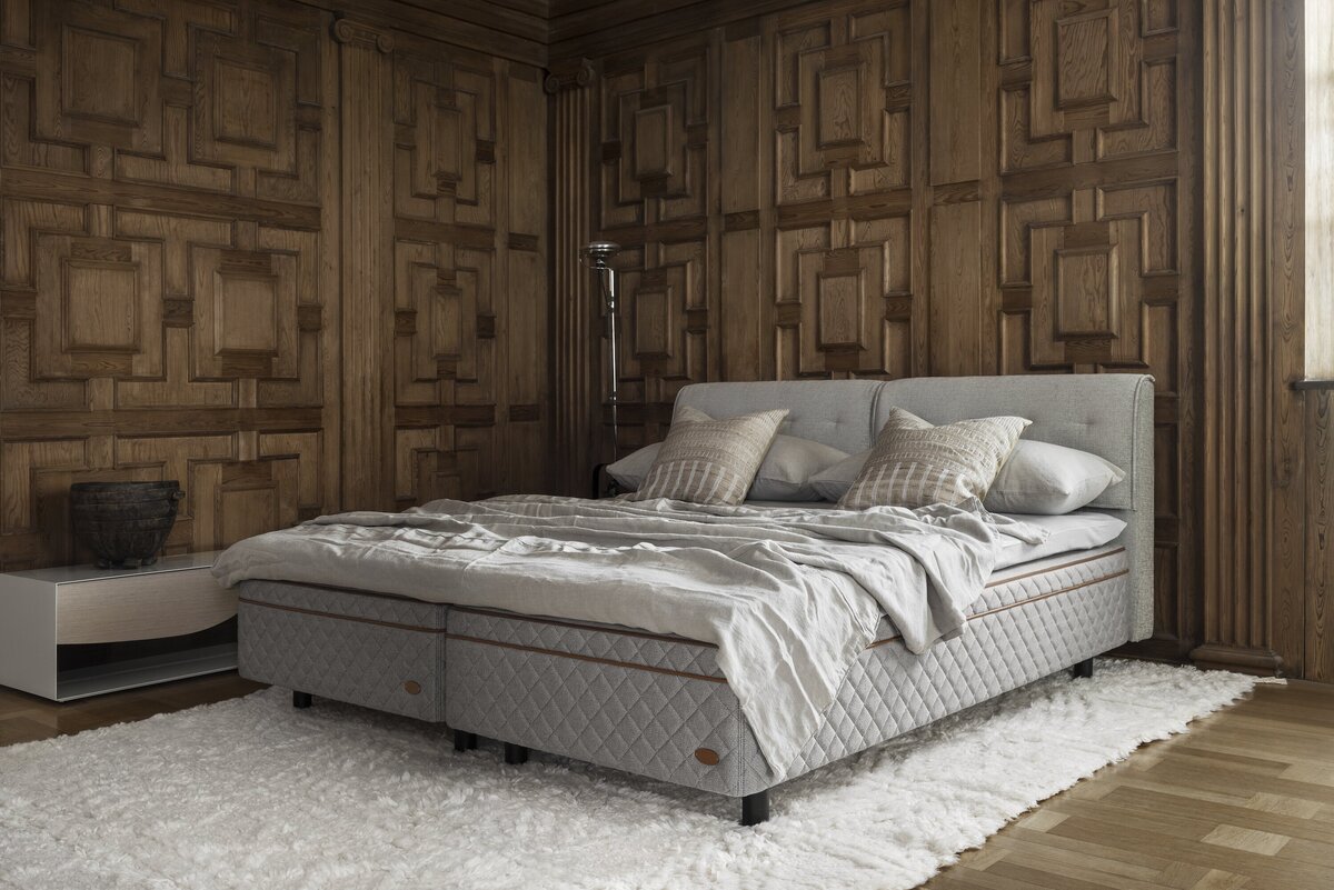 The DUX 8008 is the pinnacle of Duxianas offerings. It takes everything that makes Duxiana beds exceptional and enhances it further with a cutting edge design. The DUX 8008 is equipped with the latest in spring technology, providing an incredibly responsive sleep surface that adjusts to your body's movements throughout the night. The advanced spring system reduces motion transfer, ensuring both partners experience undisturbed sleep, even if one moves during the night. The bed features a sophisticated mix of natural materials, including soft cashmere and breathable cotton, which regulate temperature and wick away moisture to keep you cool and comfortable. This is especially important for those living in hot climates like Singapore. Whether you sleep hot or cold, this bed can be customised to provide the perfect sleeping environment, ensuring every nights rest is deeply restorative.