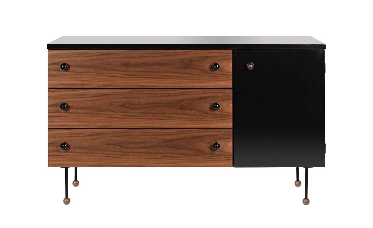 The 62 Sideboard was ahead of its time with its unique combination of materials. The elegant metal pipe legs sit on ball feet, giving this magnificent piece an airless appearance. The rectangular sideboard features black gloss panelling next to warm American Walnut that creates its luxurious appearance.