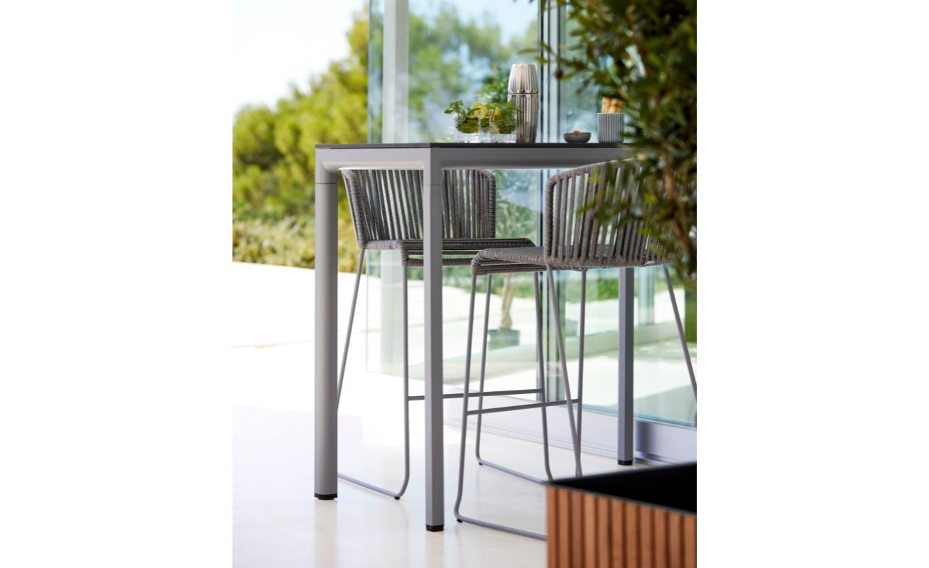 Drop Outdoor Bar Table with a Light Grey Aluminium Frame and Black Fossil Ceramic Table Top - Danish Design Co Singapore