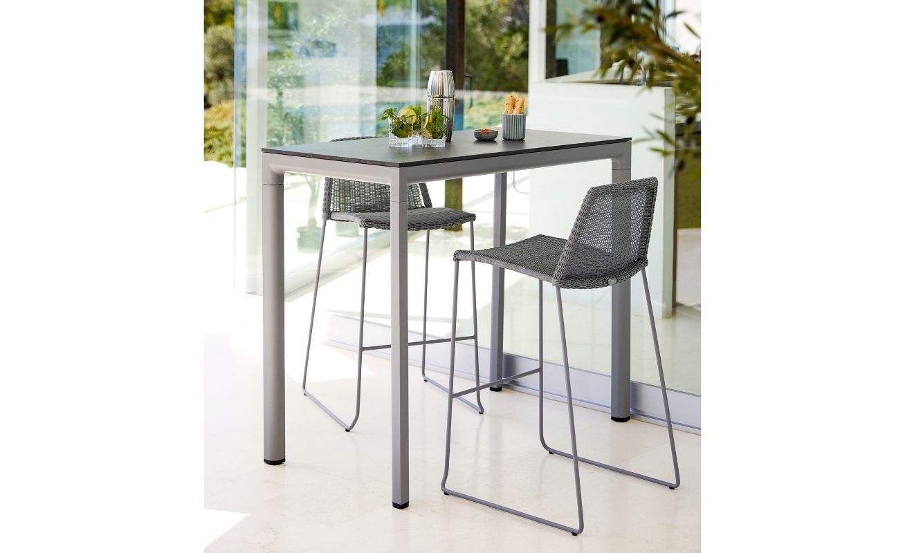 Drop Outdoor Bar Table with a Light Grey Aluminium Frame and Black Fossil Ceramic Table Top - Danish Design Co Singapore