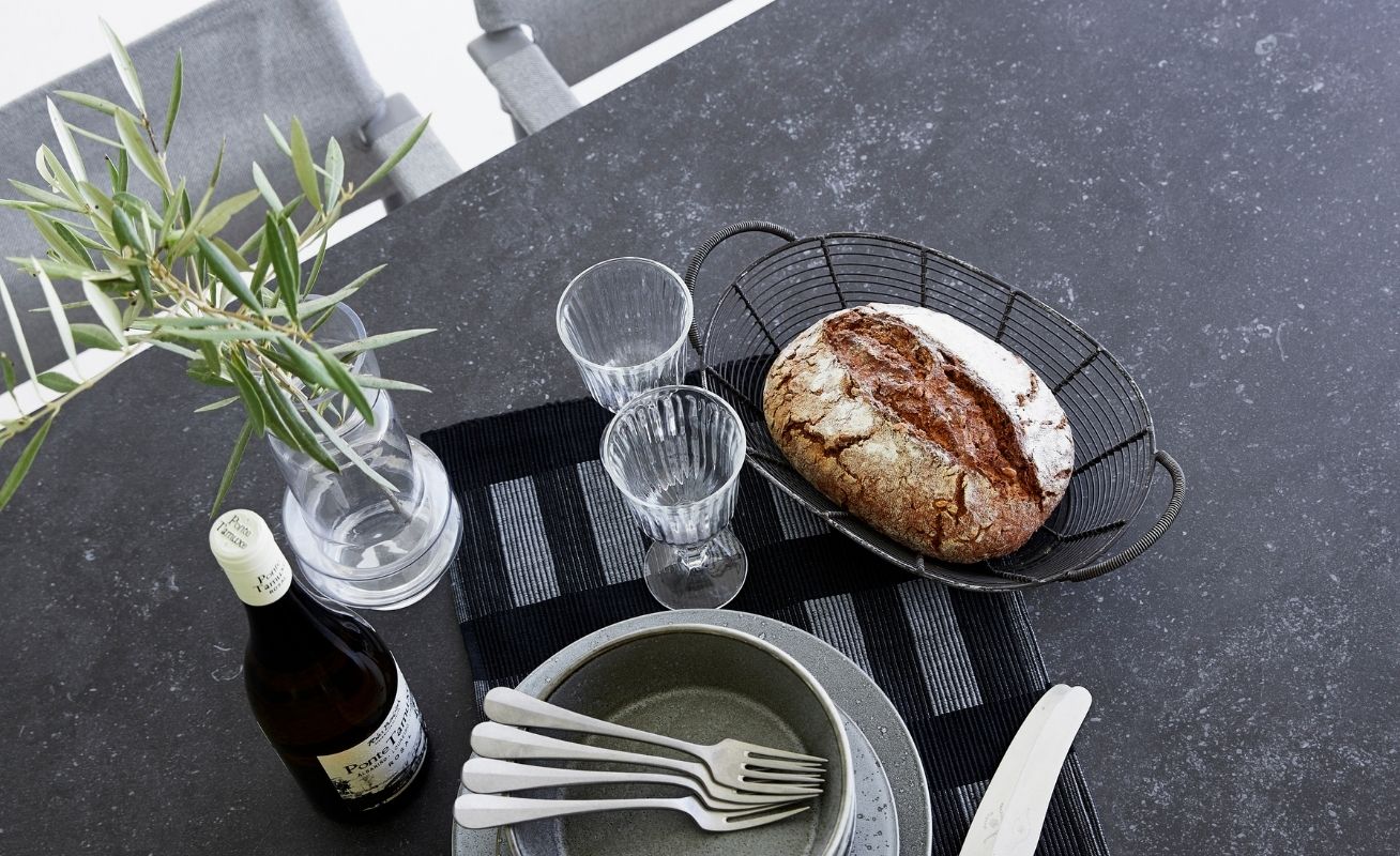 Drop Outdoor Dining Table with a Black Fossil Ceramic Table Top - Danish Design Co Singapore