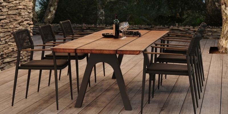 Ray Outdoor Dining Chair in Black with the Teak Pure Outdoor Dining Table